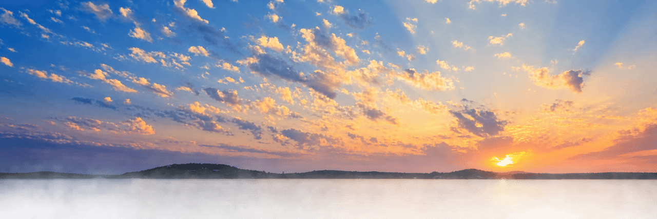 Sunset over Lake Marble Falls in the Texas Hill Country, home to the Law Office of H. Bryan Hicks